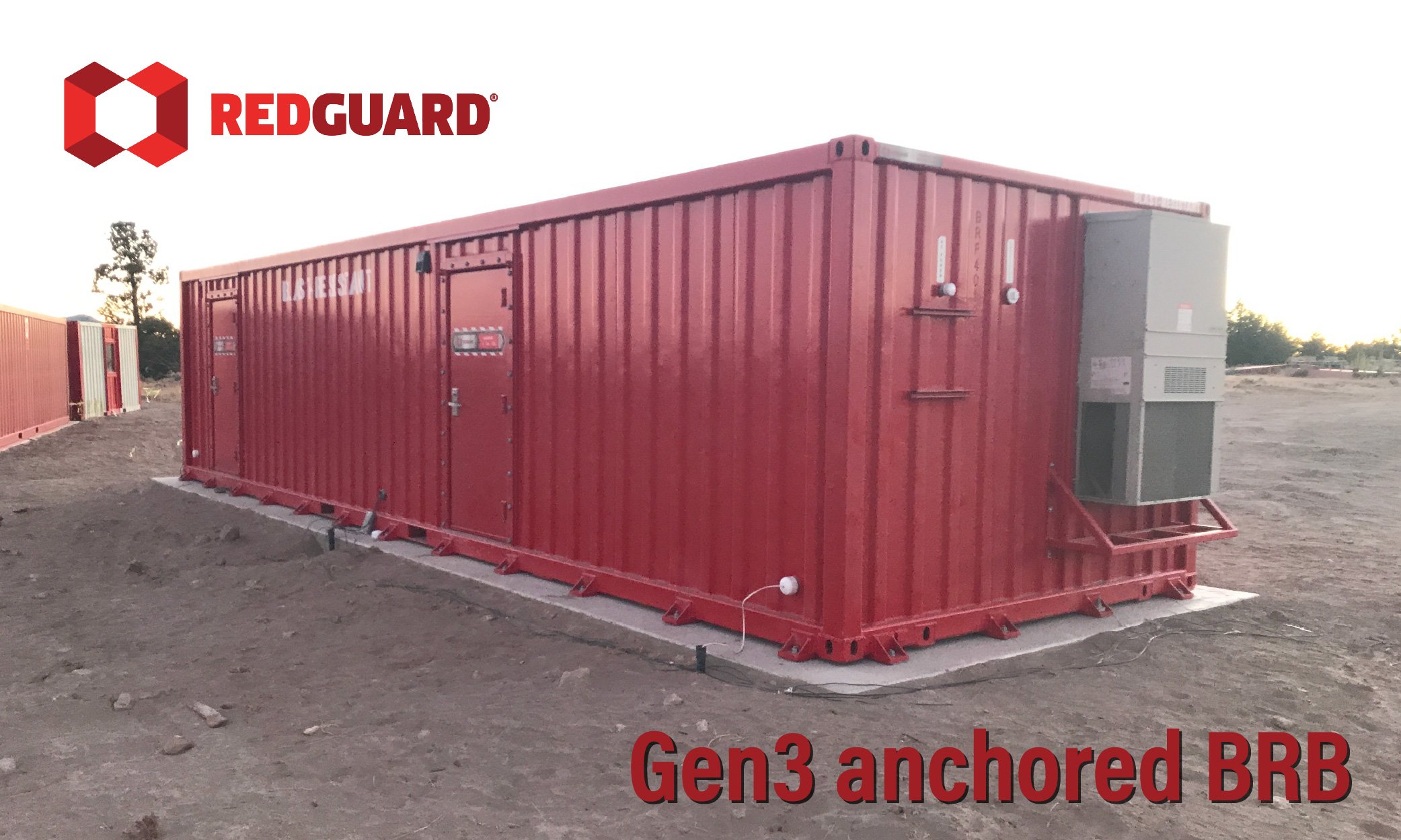 Anchored RedGuard blast-resistant building installed on a concrete foundation for blast testing.